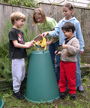Photo of children composting into a cone