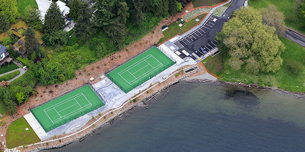 Aerial photo of tennis courts on top of storage tank in Seward Park.