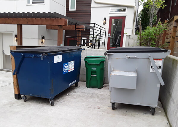 Photo of three solid waste containers