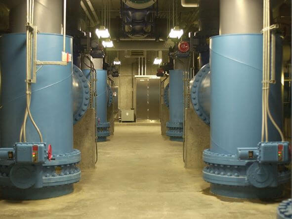 Large vertical pipes inside the facility.