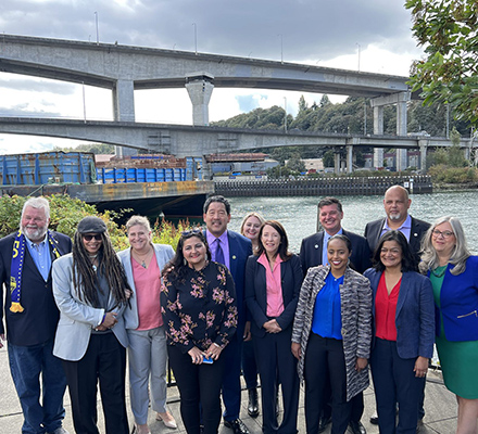 The mayor and others pose at the bridge reopening press conference