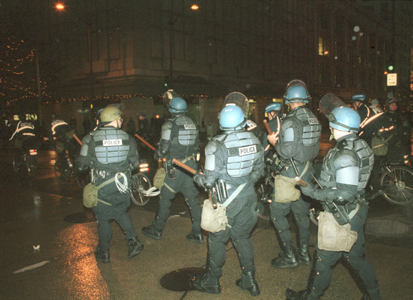 Citation: Police in riot gear, November 29, 1999.  Unprocessed Image Bank Negatives, Binder 990909-20000330, Sheet 1999. 991206.02 #15. Seattle Municipal Archives.