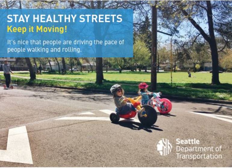 children riding big wheels and being glad people are driving the pace of people walking and rolling