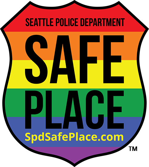This place is a safe place for victims of hate crime and harassment to seek sanctuary inside, have us call 911, and wait for the police to arrive. The Safe Place symbol depicts a police shield surrounding the colors that traditionally have symbolized the LGBTQ community since the 1970s. In 2018, the language on all decals was updated to encourage the reporting of all bias crimes, in all communities, not just LGBTQ. The SPD Safe Place decal is meant to convey inclusion and intersectionality with any and all individuals, regardless of their race, political beliefs, nationality, age, gender, sexual orientation and/or identification, or any other differences either actual or perceived. This place is a safe place for victims of hate crime and harassment to seek sanctuary inside, have us call 911, and wait for the police to arrive. The Safe Place symbol depicts a police shield surrounding the colors that traditionally have symbolized the LGBTQ community since the 1970s. In 2018, the language on all decals was updated to encourage the reporting of all bias crimes, in all communities, not just LGBTQ. The SPD Safe Place decal is meant to convey inclusion and intersectionality with any and all individuals, regardless of their race, political beliefs, nationality, age, gender, sexual orientation and/or identification, or any other differences either actual or perceived.