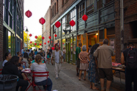 People enjoying the Canton Alley festival street