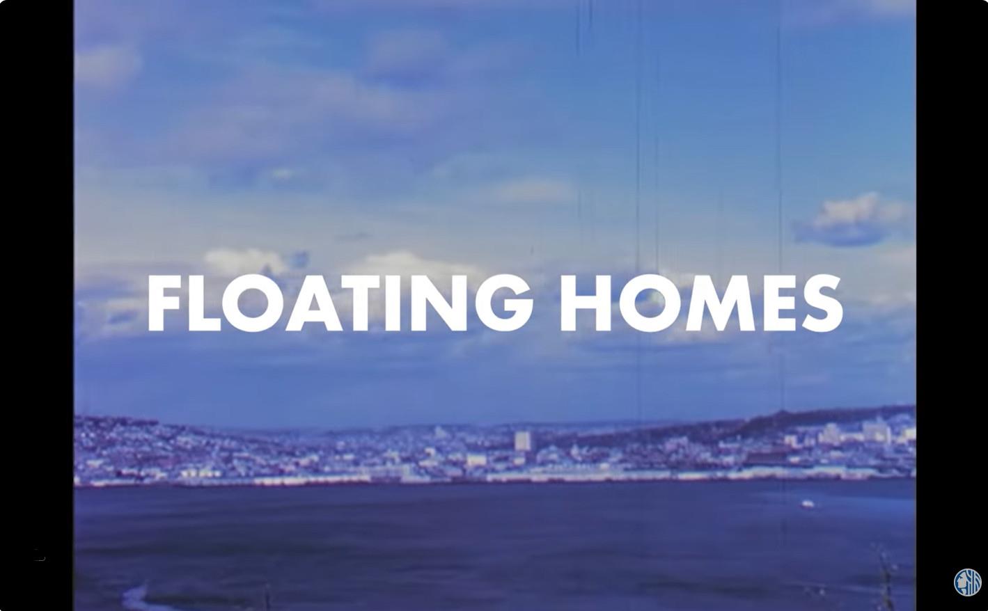 screen shot of video title card reading "Floating Homes" over photo of Lake Union