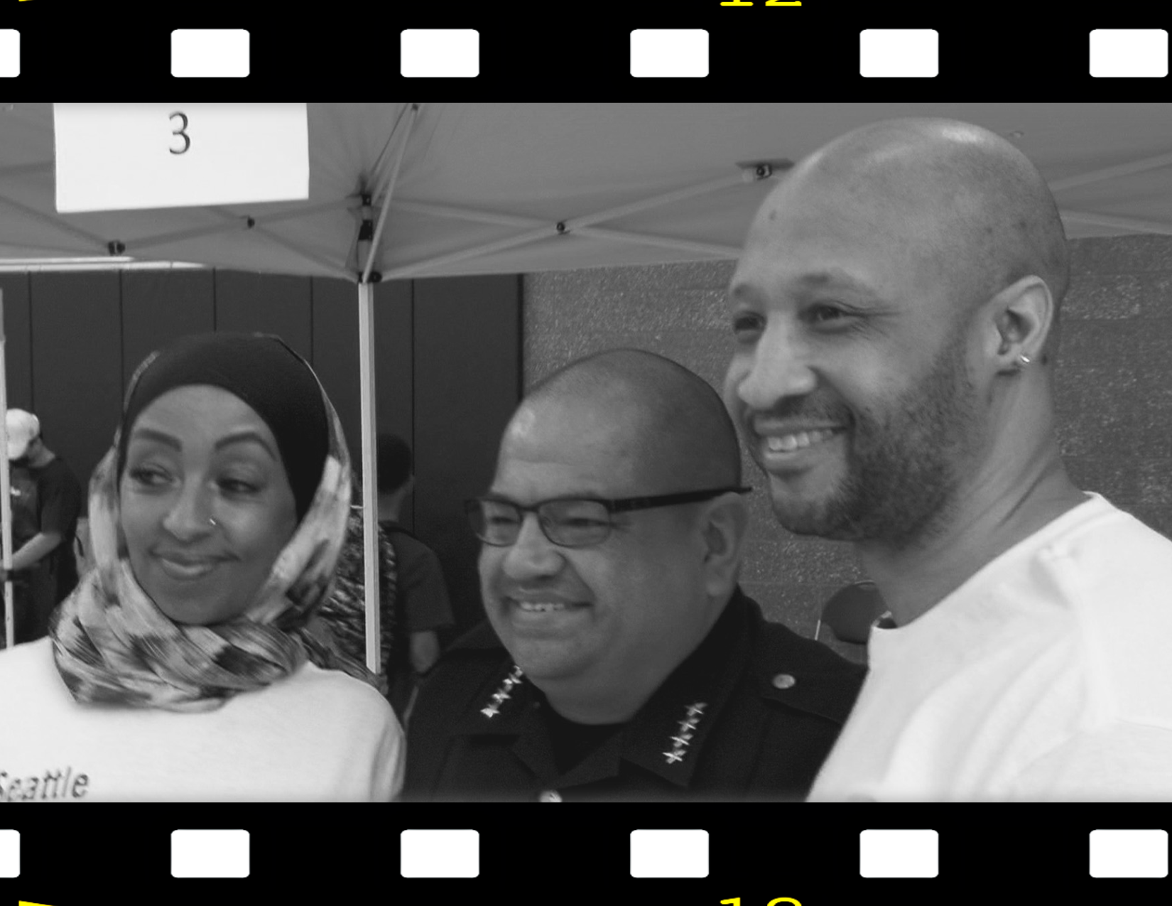 Photo of Mergitu Argo, Seattle Police Chief Adrian Diaz and Jo-Nathan Thomas