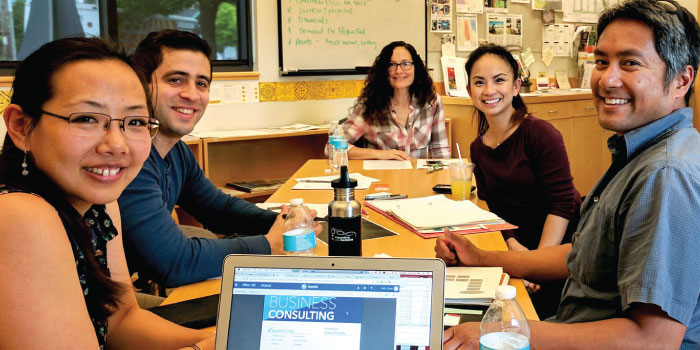 A group of small business owners meeting at a table