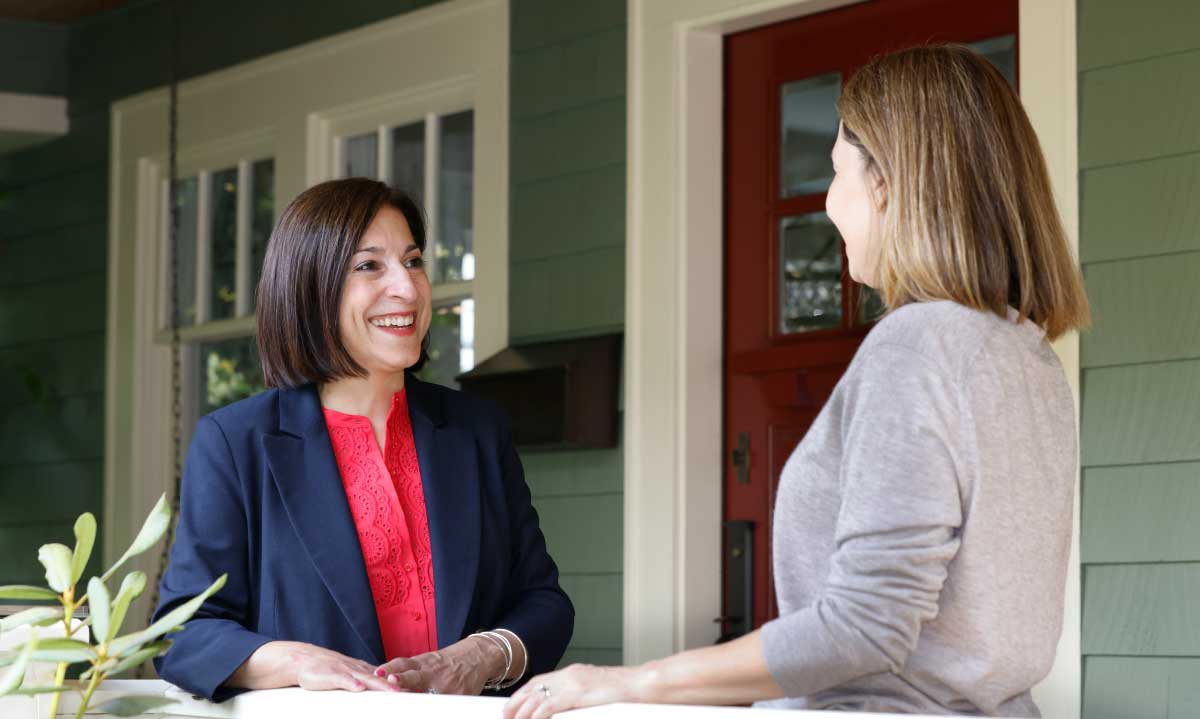 Councilmember Maritza Rivera talking to constituent