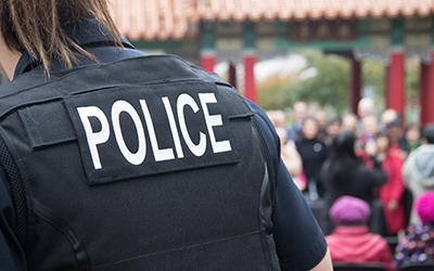 police person in uniform in front of crowd