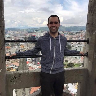 Jason Jay standing on a balcony