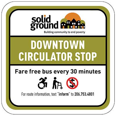 Image of a sign that reads: Solid Ground: Downtown Circulator Stop. Fare free bus every 30 minutes. 