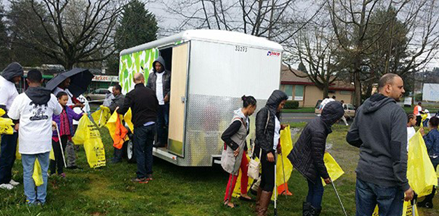 Group of  people  getting supplies to do a trash clean-up in a park