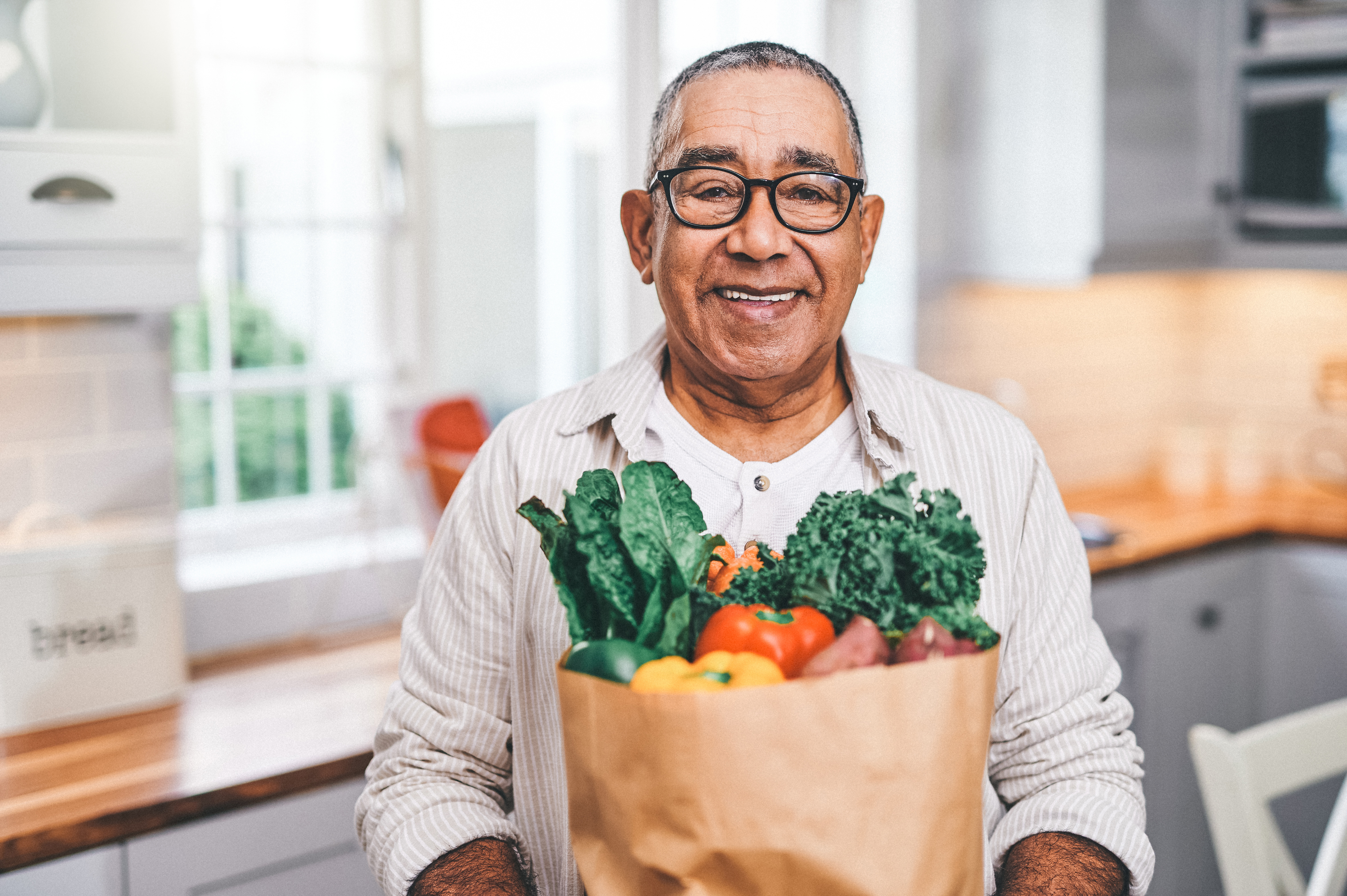 Small Business Owner Offering Groceries