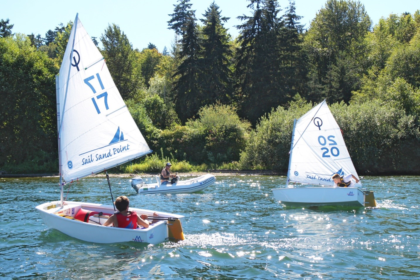 kids sailing in small boats