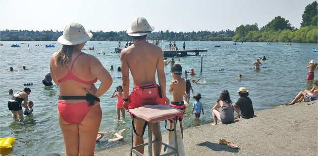 Two lifeguards watch the beach at Green Lake