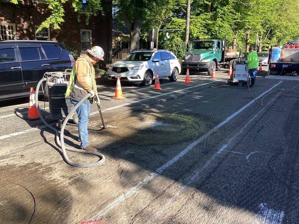 Crews installing signal detection loops on Beacon Ave S at the S Spokane St intersection