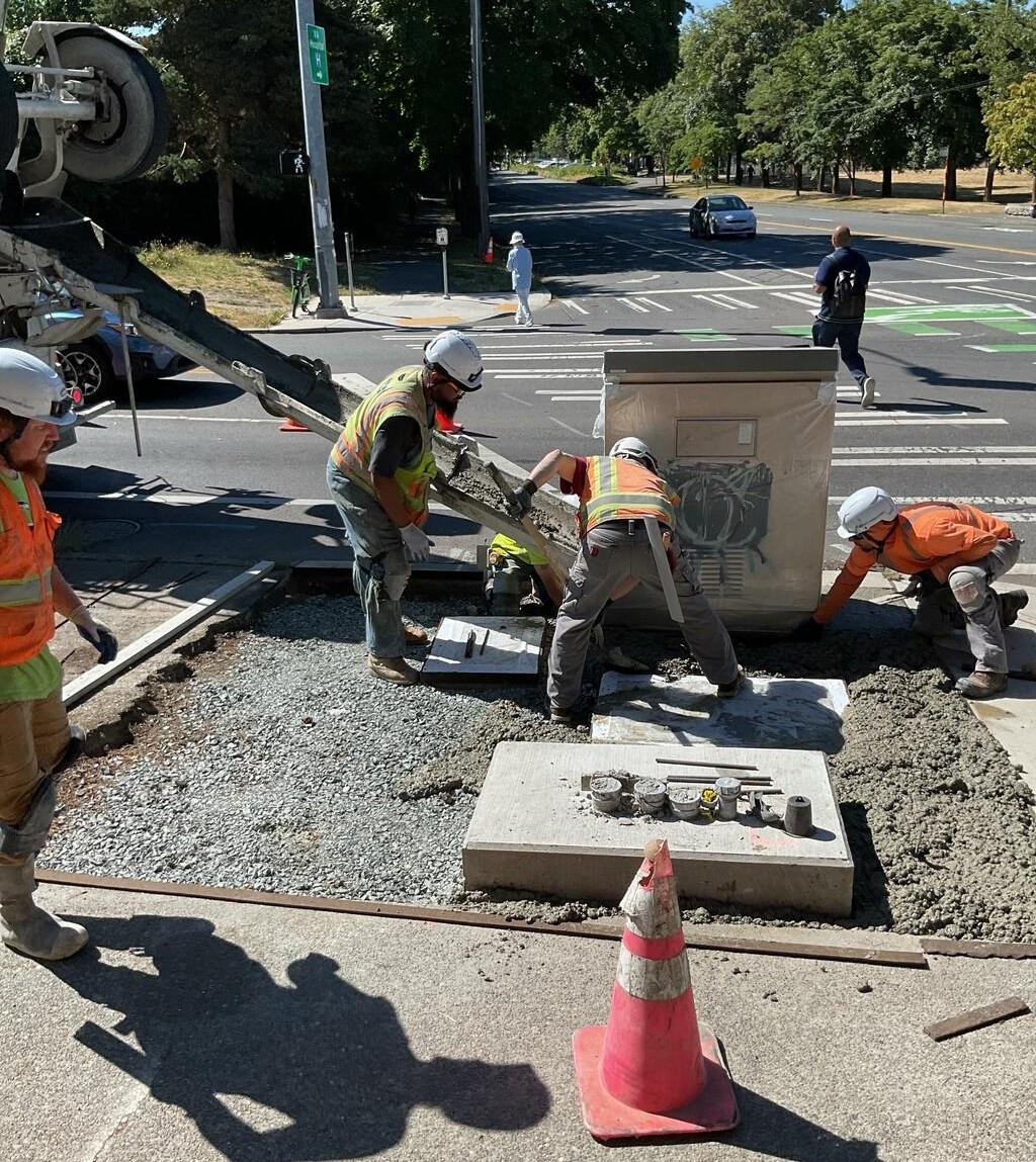 Crews pouring sidewalk on Beacon Ave S near S Spokane St.
