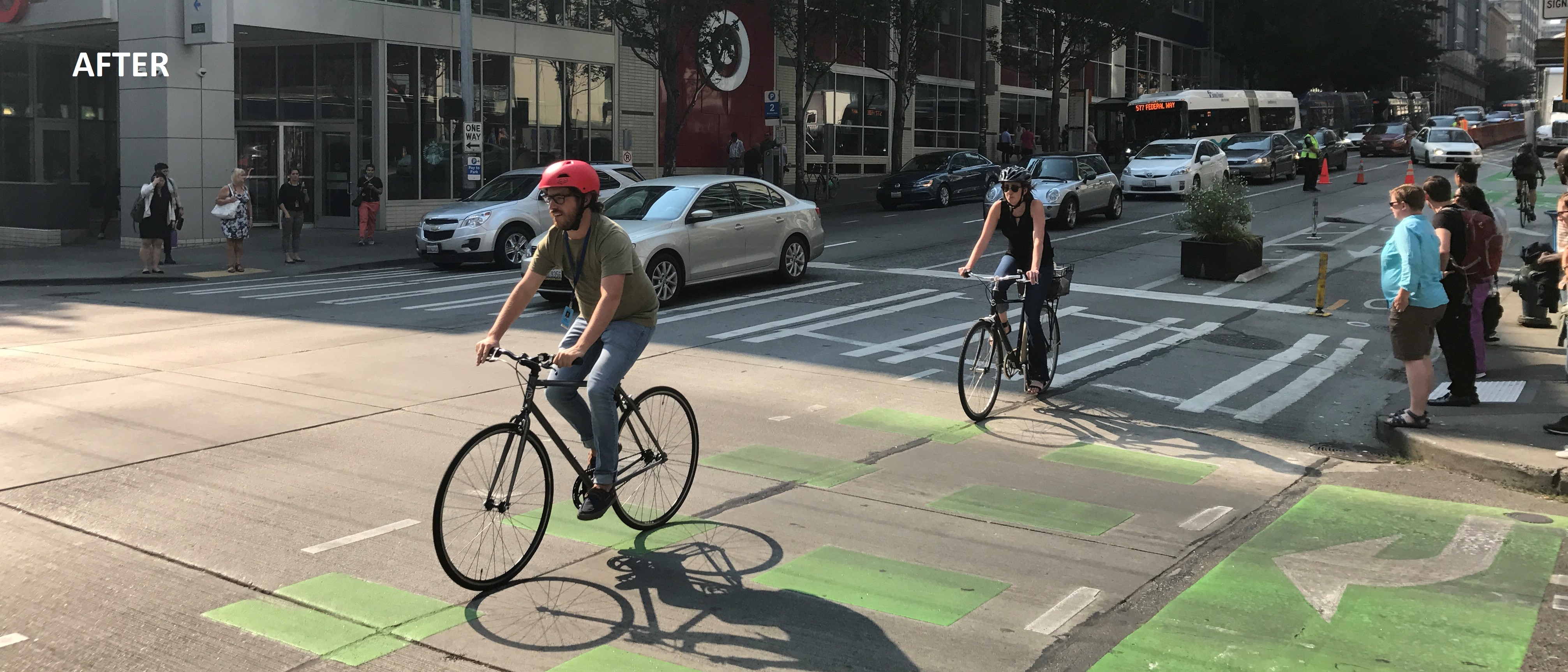 After protected bike lane is installed on Pike St, showing more bikers biking safely
