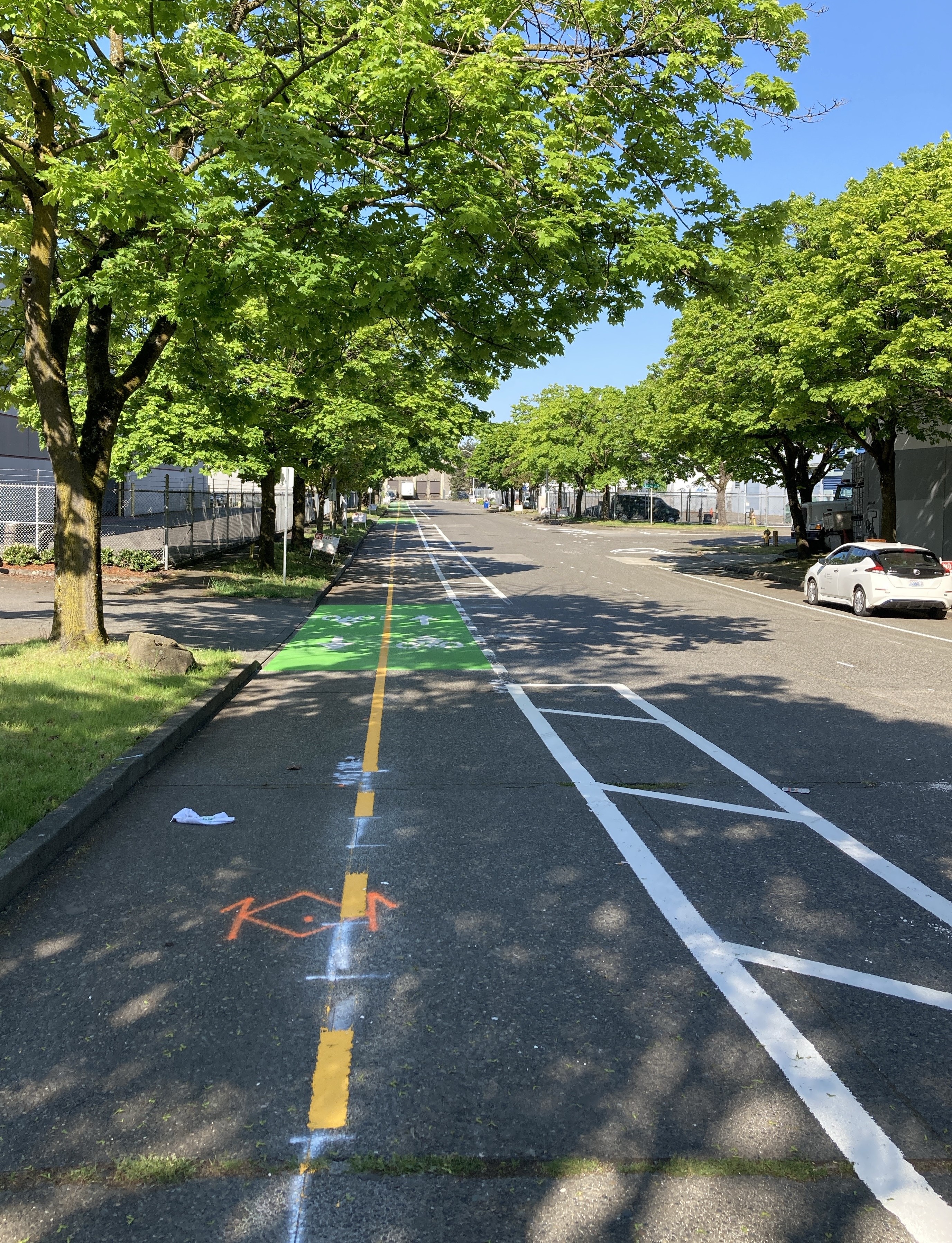Newly striped two-way bike lanes on the south side of S Alaska St looking west.