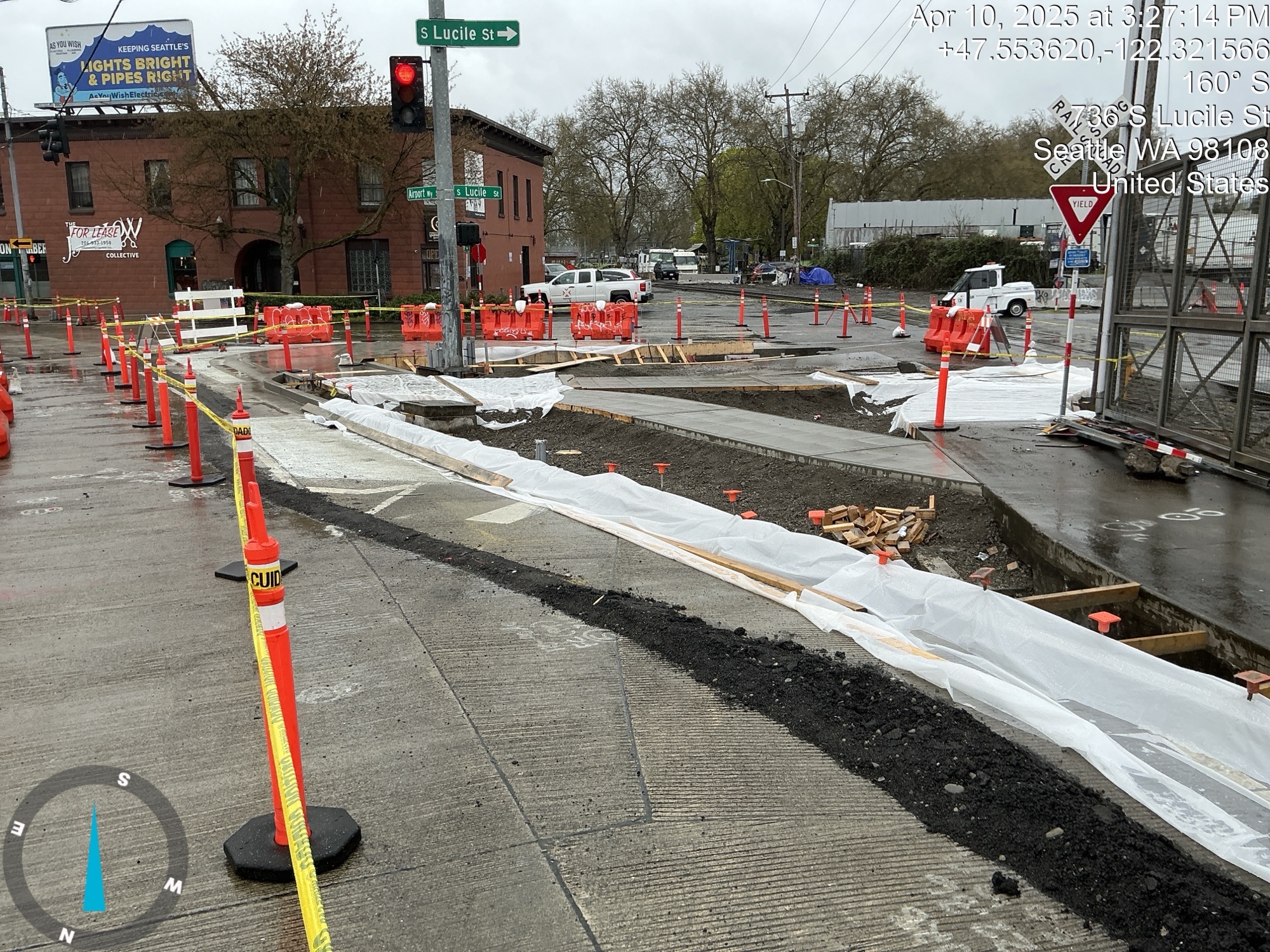 Looking at the newly constructed pedestrian curb at S Lucile St from Airport Way S