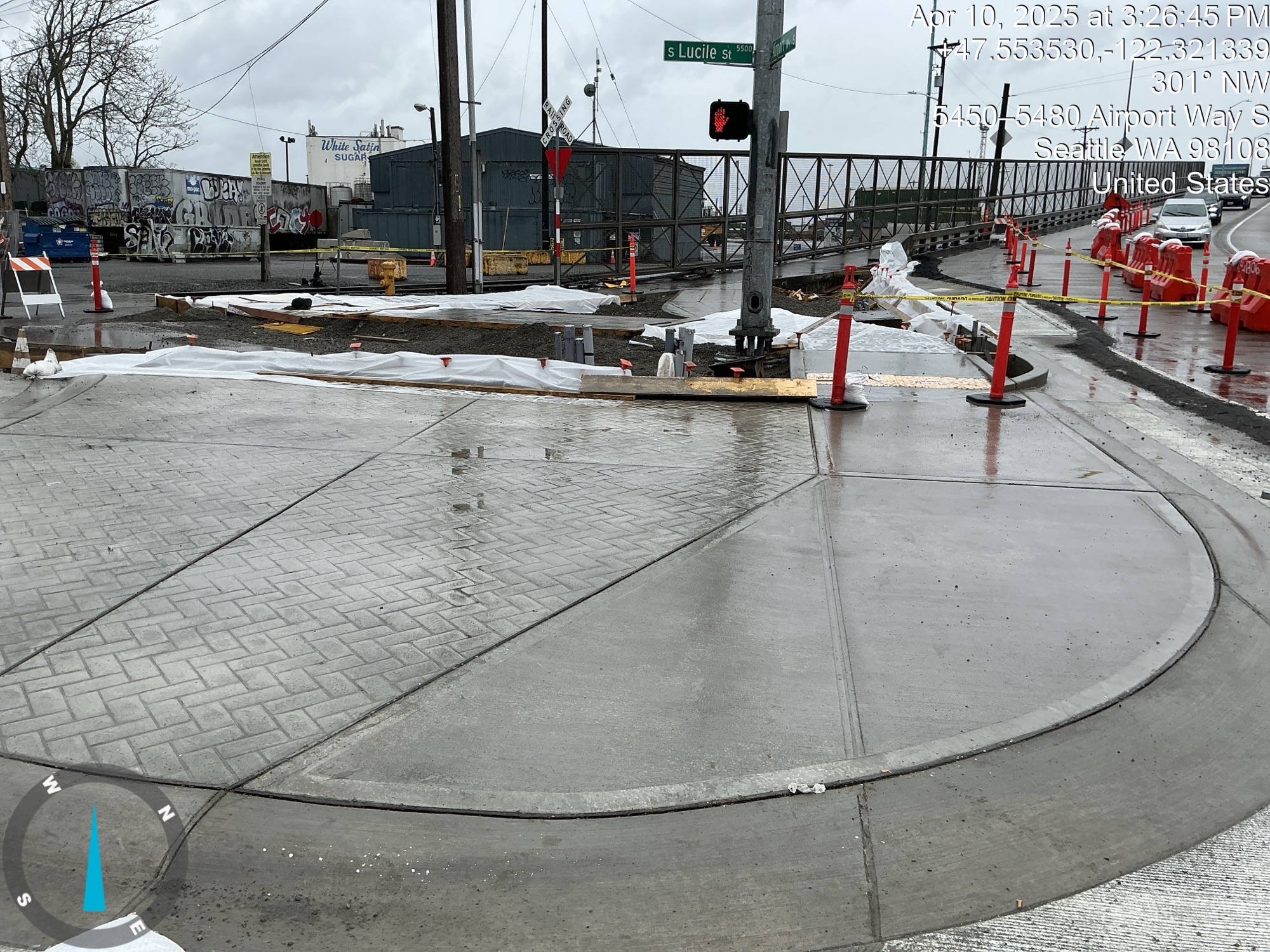 A view of the newly constructed pedestrian curb at the intersection of Airport Way S and S Lucile St