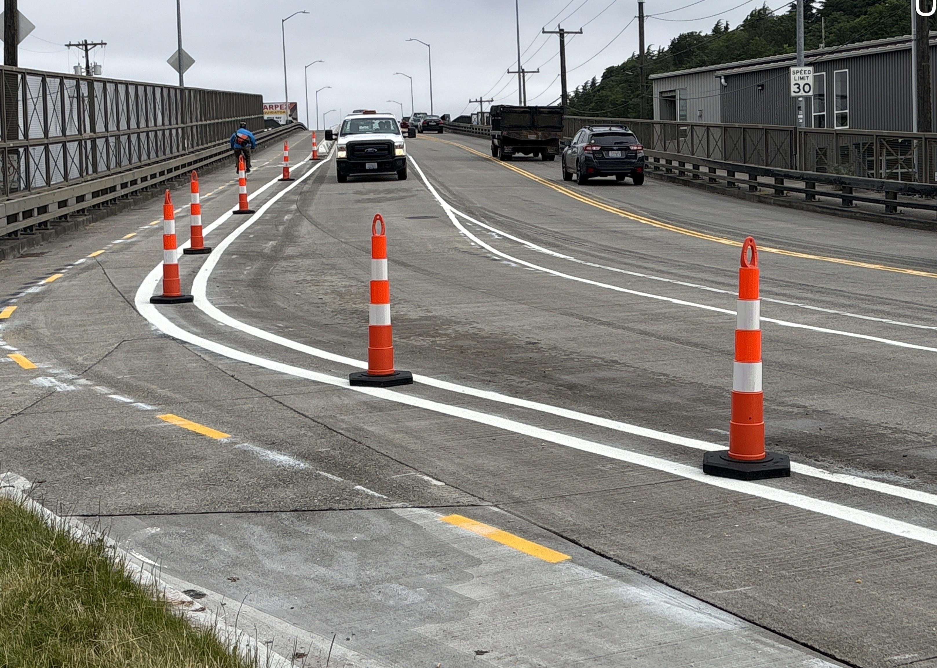 Photo showing new striping on Airport Way S looking north onto the bridge.