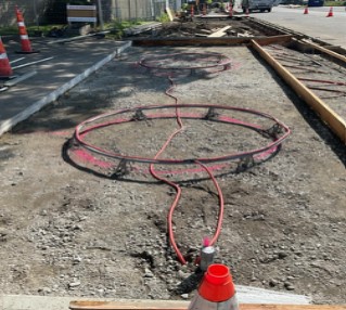 Crews installing signal detection loops at the intersection of Ellis Ave S and S Myrtle St