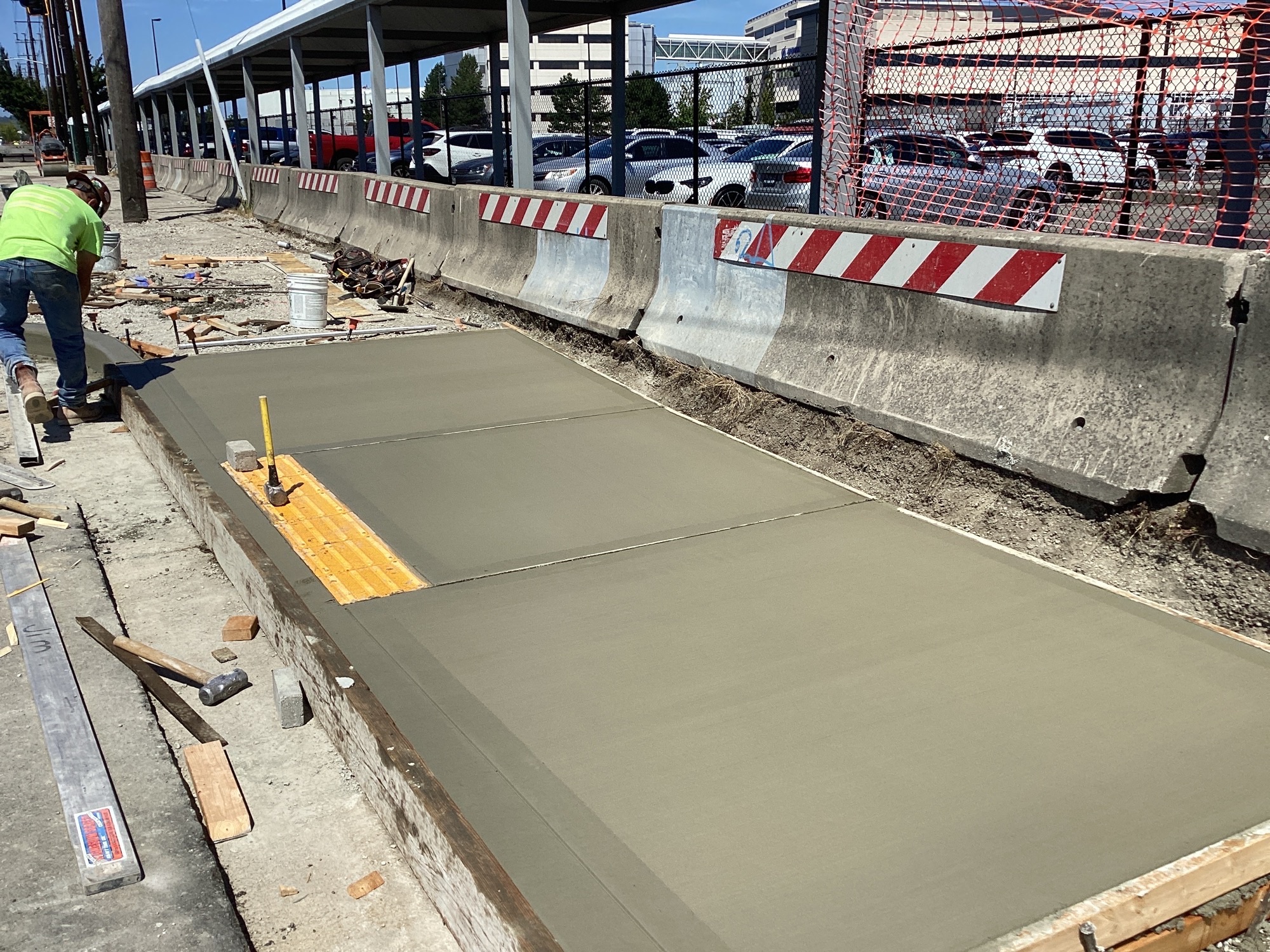 Recently poured concrete for a segment of the multi-use trail on E Marginal Way S.