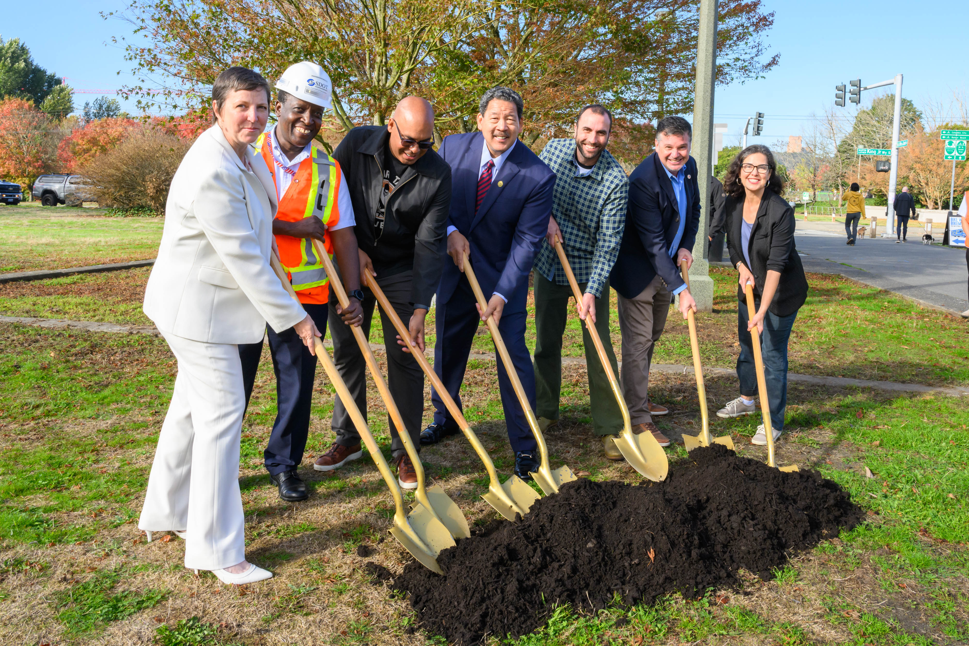 Photo showing Mayor Harrell, Director Spotts, and project supporters holding shovel during groundbreaking ceremony.event.