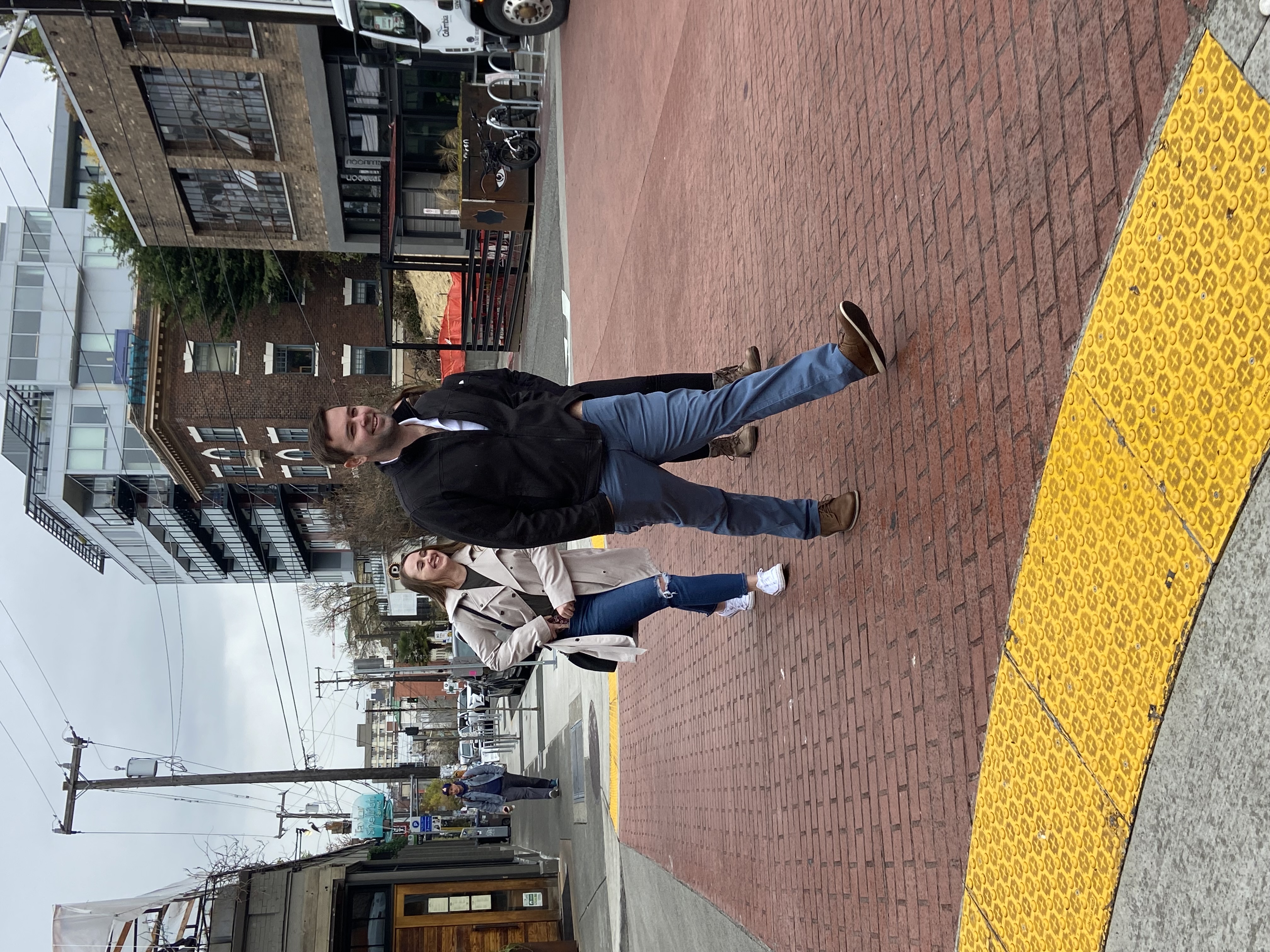 People walking in the new raised intersection at Melrose Ave and Minor Ave