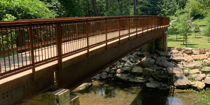 A photo of a concrete pedestrian bridge similar to the proposed bridge design