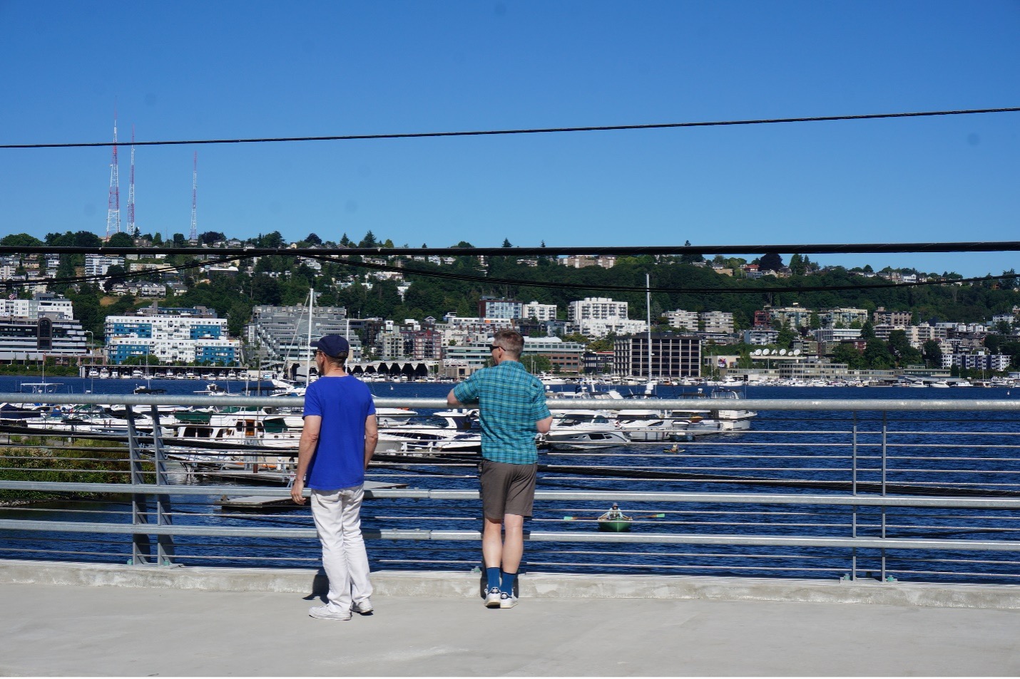 Photo of pedestrian enjoying view of Lake Union on new Fairview Ave N Bridge.