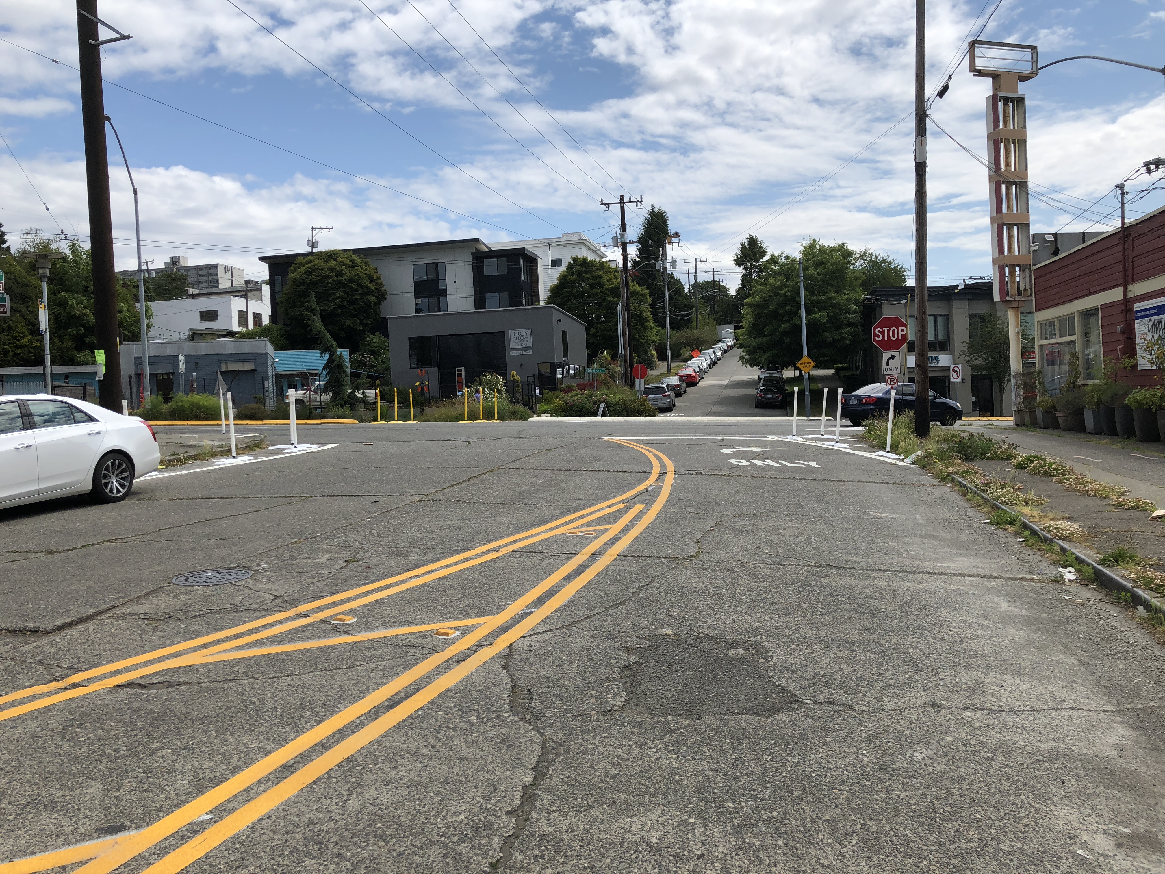Vision Zero paint and post turn restriction at S King St and Rainier Ave S