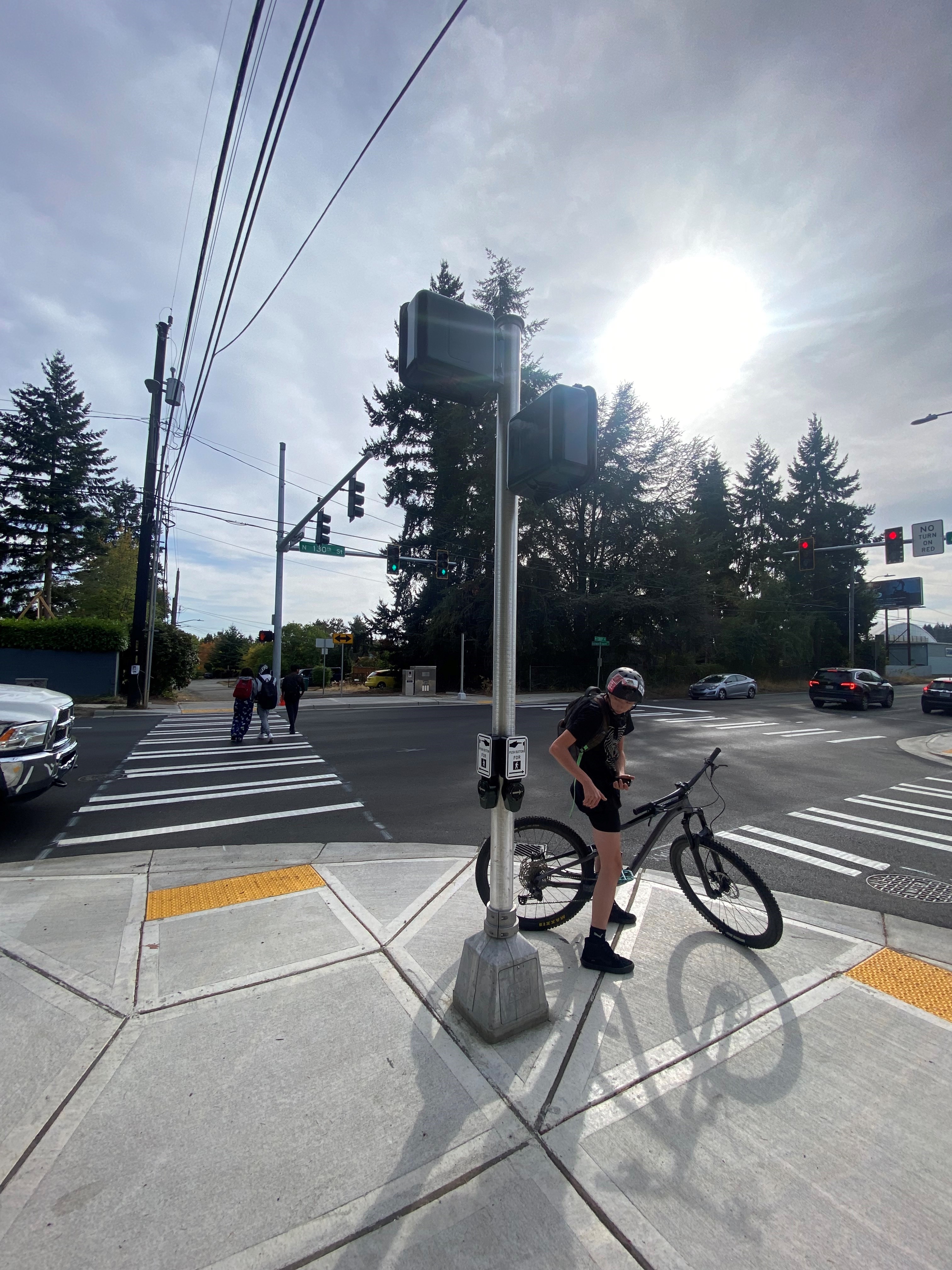 Ingraham High School students using newly installed crossing signal at Ashworth Ave N & N 130th St