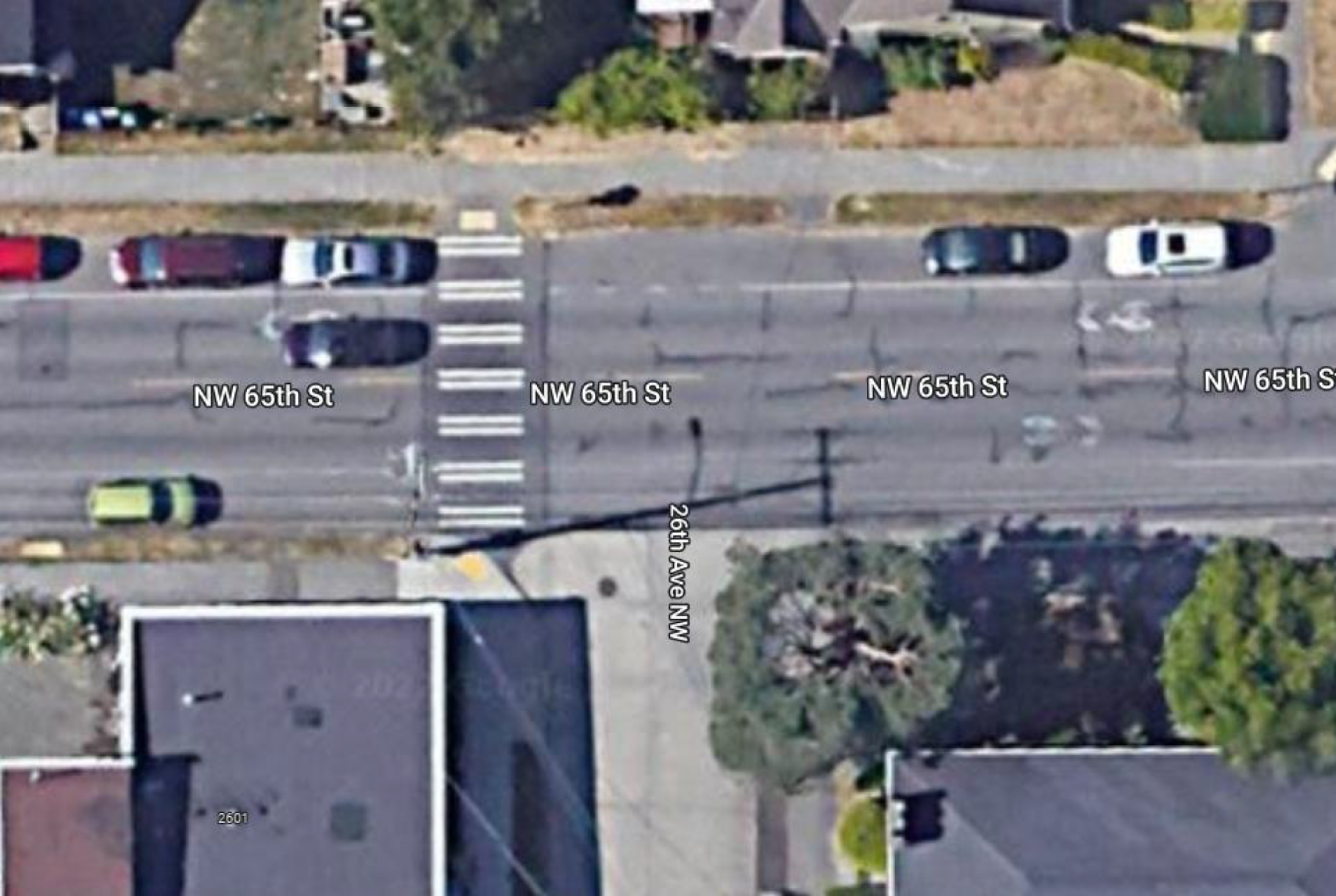 Satellite image of NW 65th St & 26th Ave NW intersection showing where new pavement markings will go