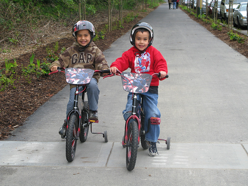 Two children riding bikes on the Burke Gilman Trail