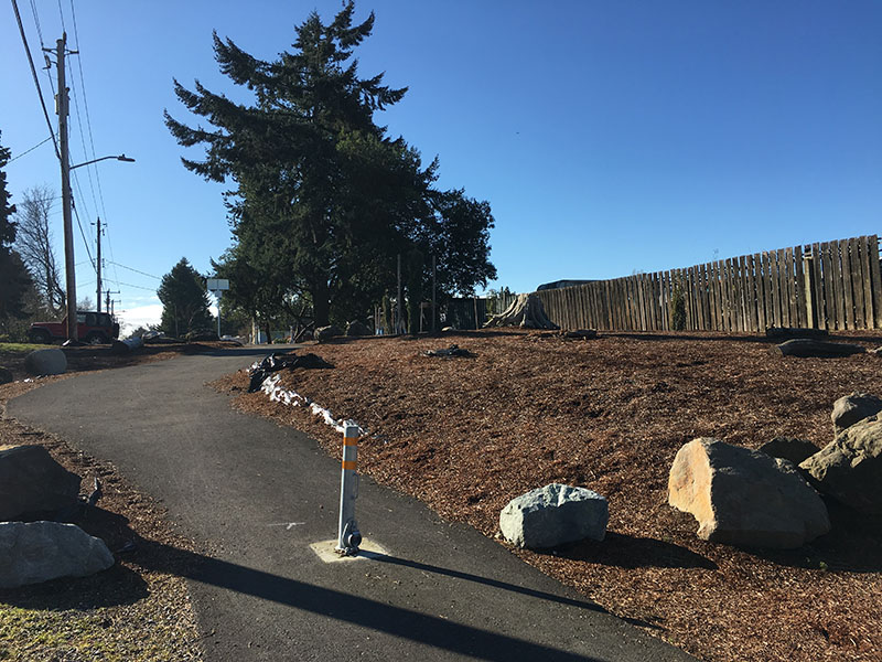 A photo of an example bike trail with a center bollard