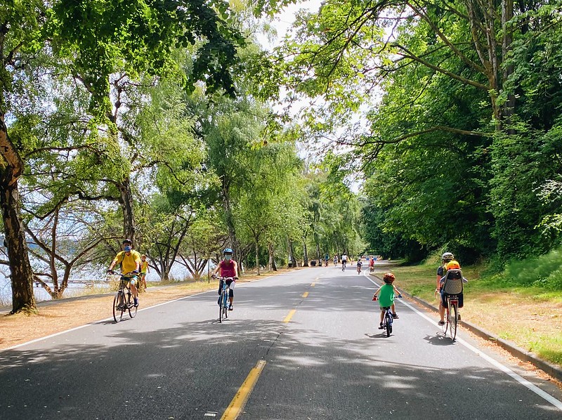 bikers with helmets wearing face masks on a sunny day