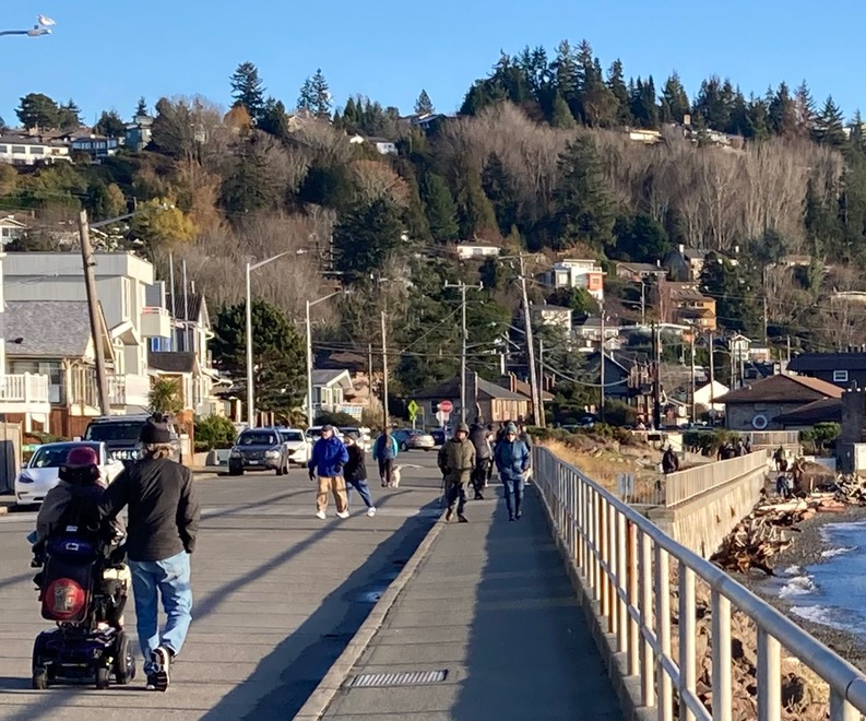 Multiple users parked, walking, and rolling on the temporary Stay Healthy Street in 2020