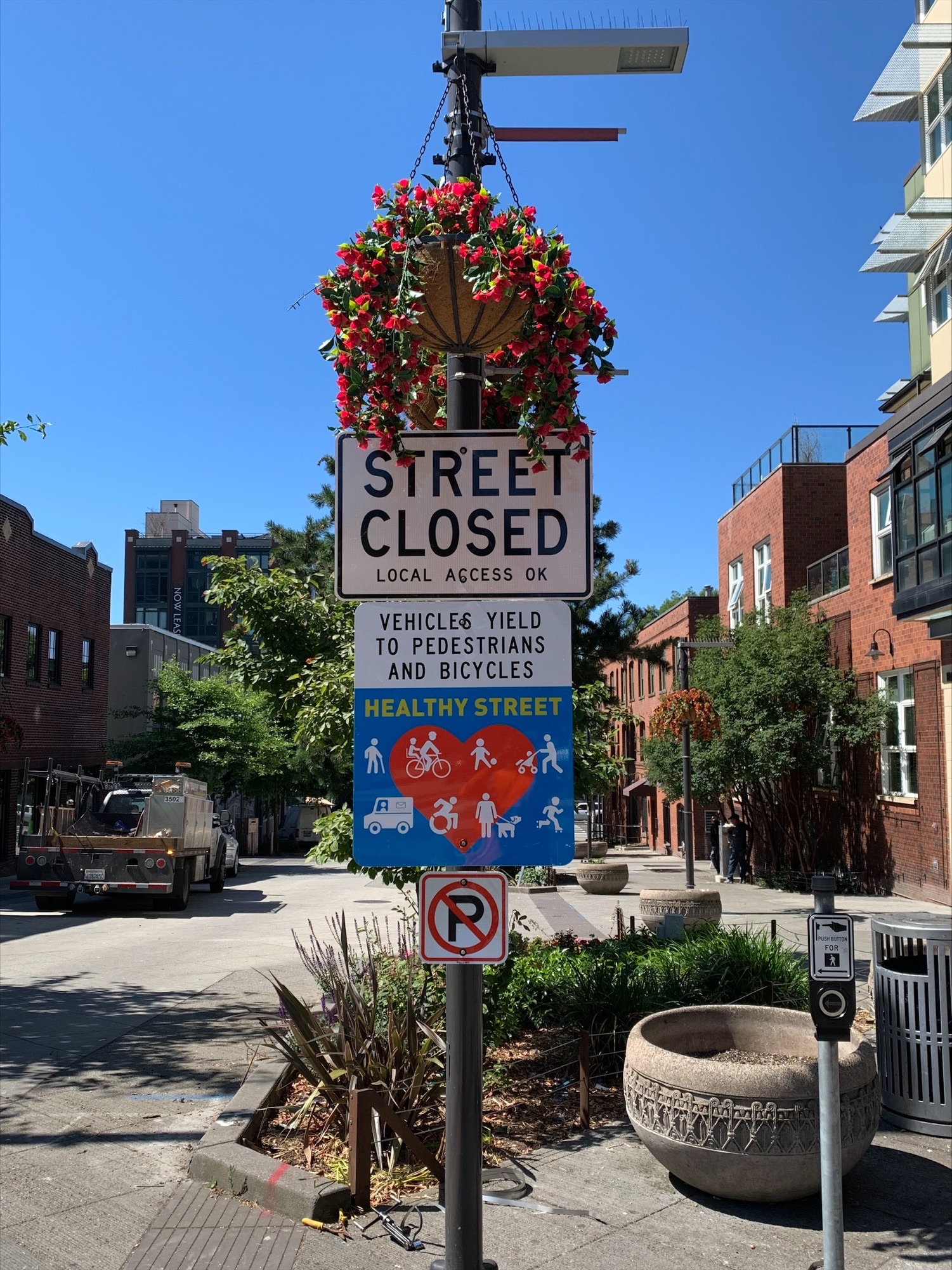 Close up photo of newly installed Stay Healthy Street sign on Bell Street.