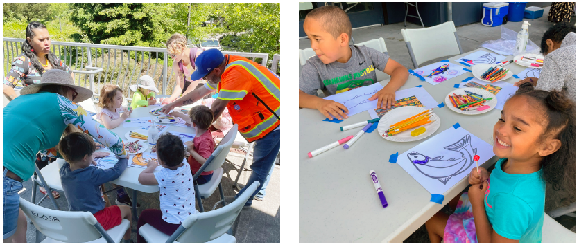 High Point community members draw designs onto an outline of a salmon. Photo courtesy of Seattle Housing Authority.  
