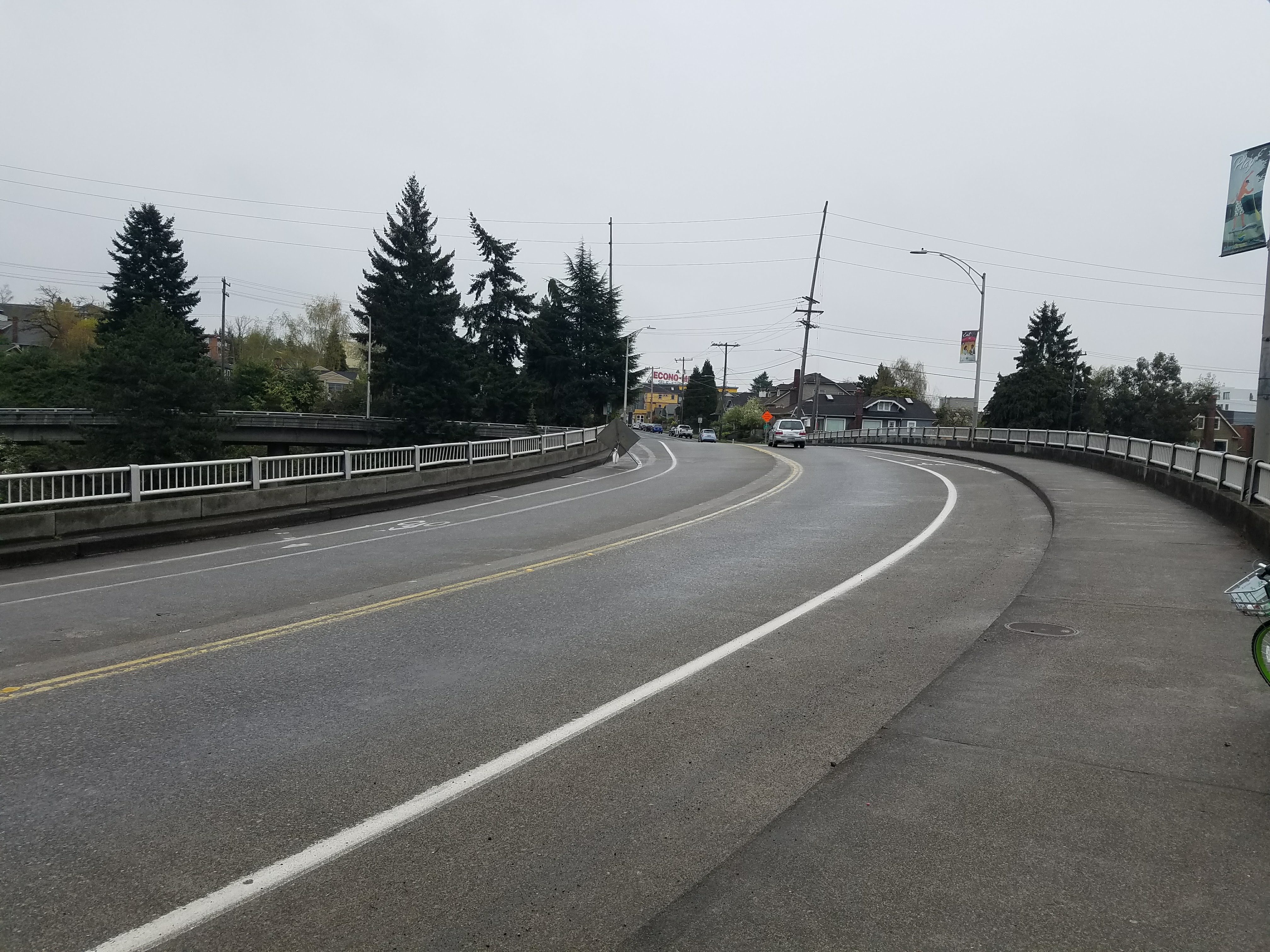 Photo showing overpass before protected bike lane and pedestrian path improvements