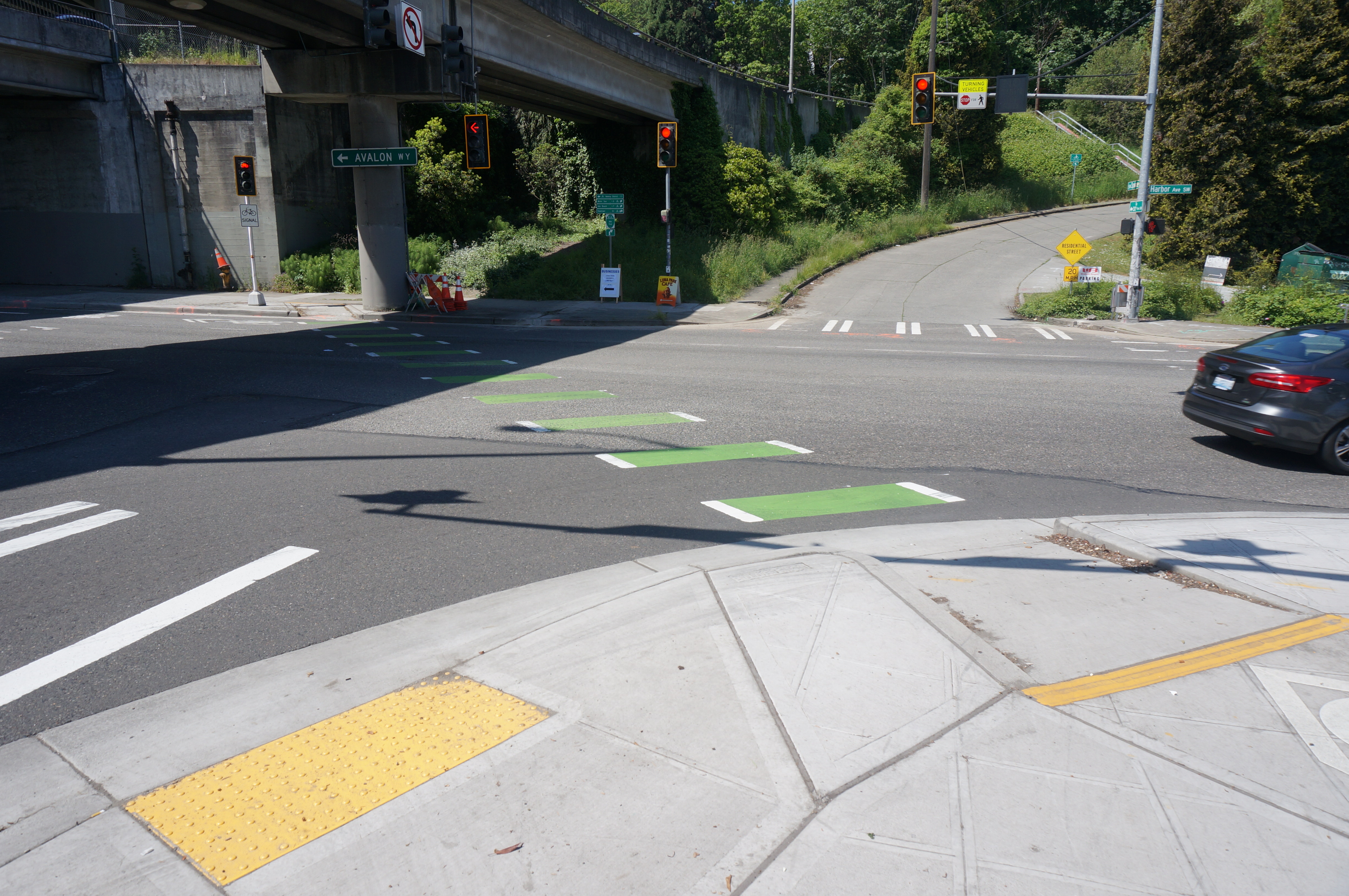 New bike-only signal and curb bulb at the intersection of Harbor Ave SW and SW Spokane St