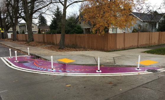 Artistic paint and post curb bulb on 8th Ave S