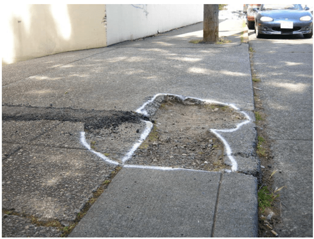 Missing sidewalk gap painted in white.