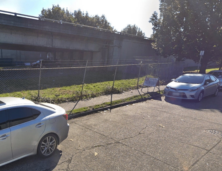 This sidewalk is blocked by a temporary no park A frame sign. 