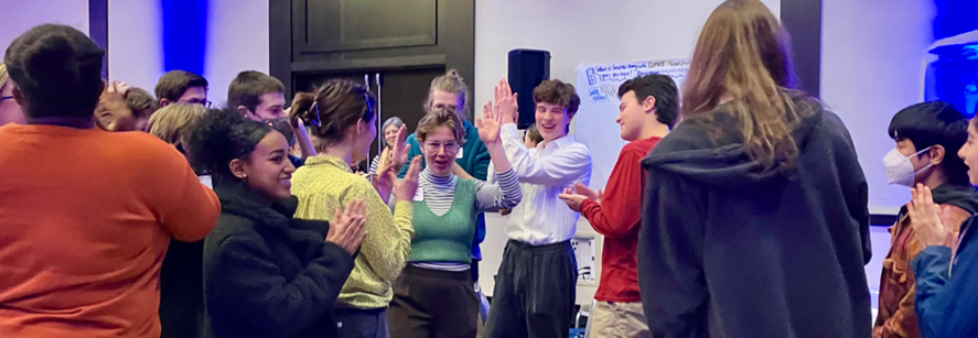 Participants at the 2023 Youth Summit doing an interactive workshop on Climate and Transportation Justice.