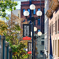 Red and black pole banners on the lamp posts indicating the Pioneer Square neighborhood