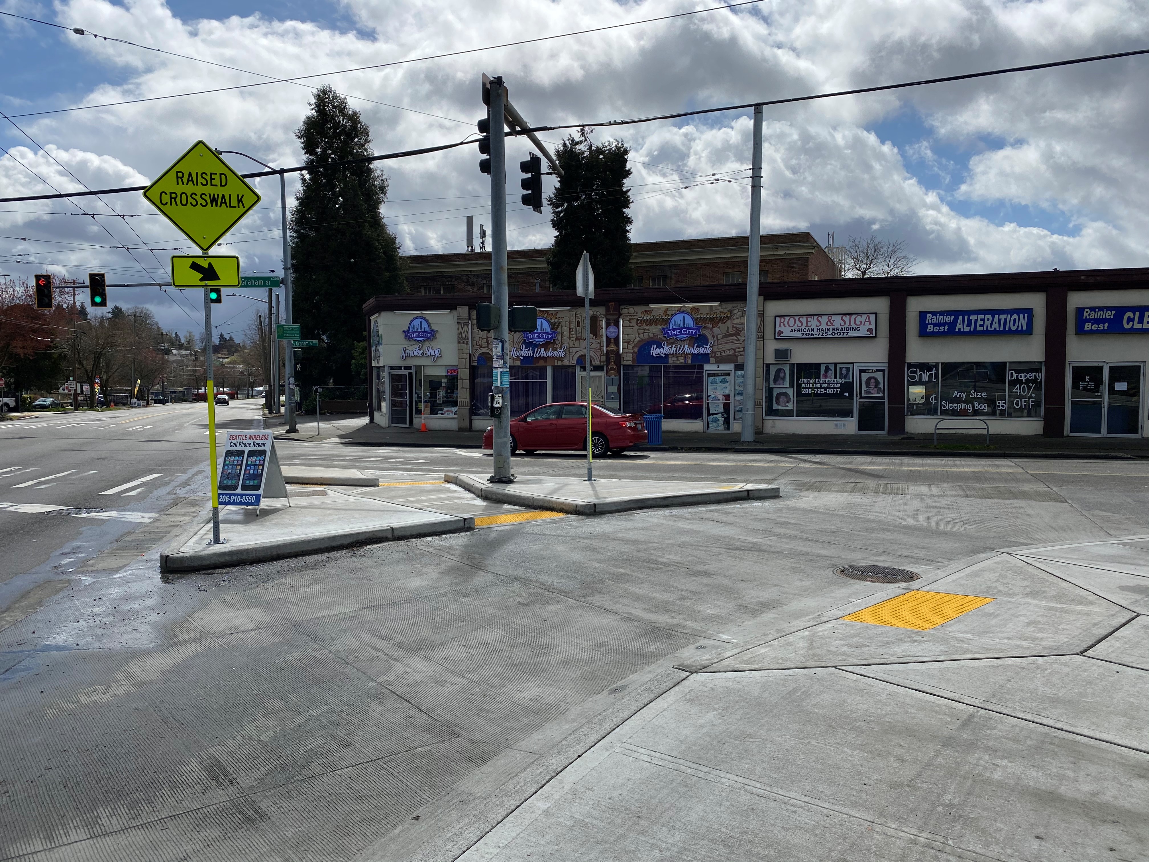 Image of updated curb ramp and extended sidewalk at S Graham St and Rainier Ave S